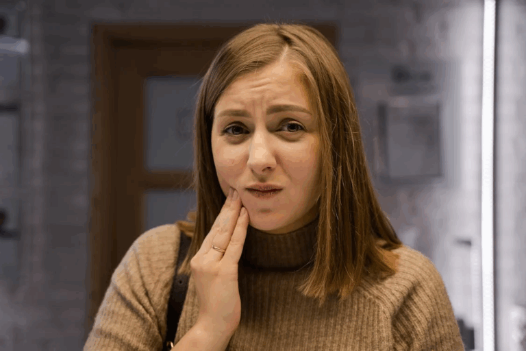 a woman experiencing tooth pain